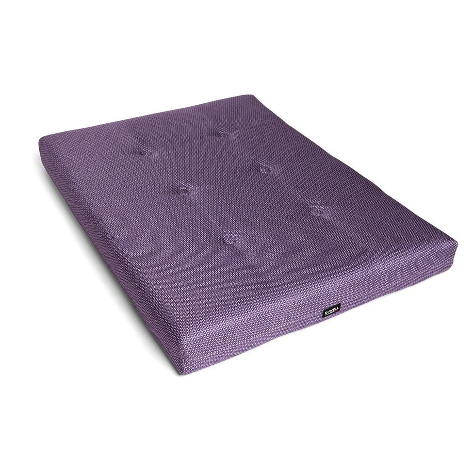 A pillow for sitting, practicing yoga or to use other yoga pillows on.